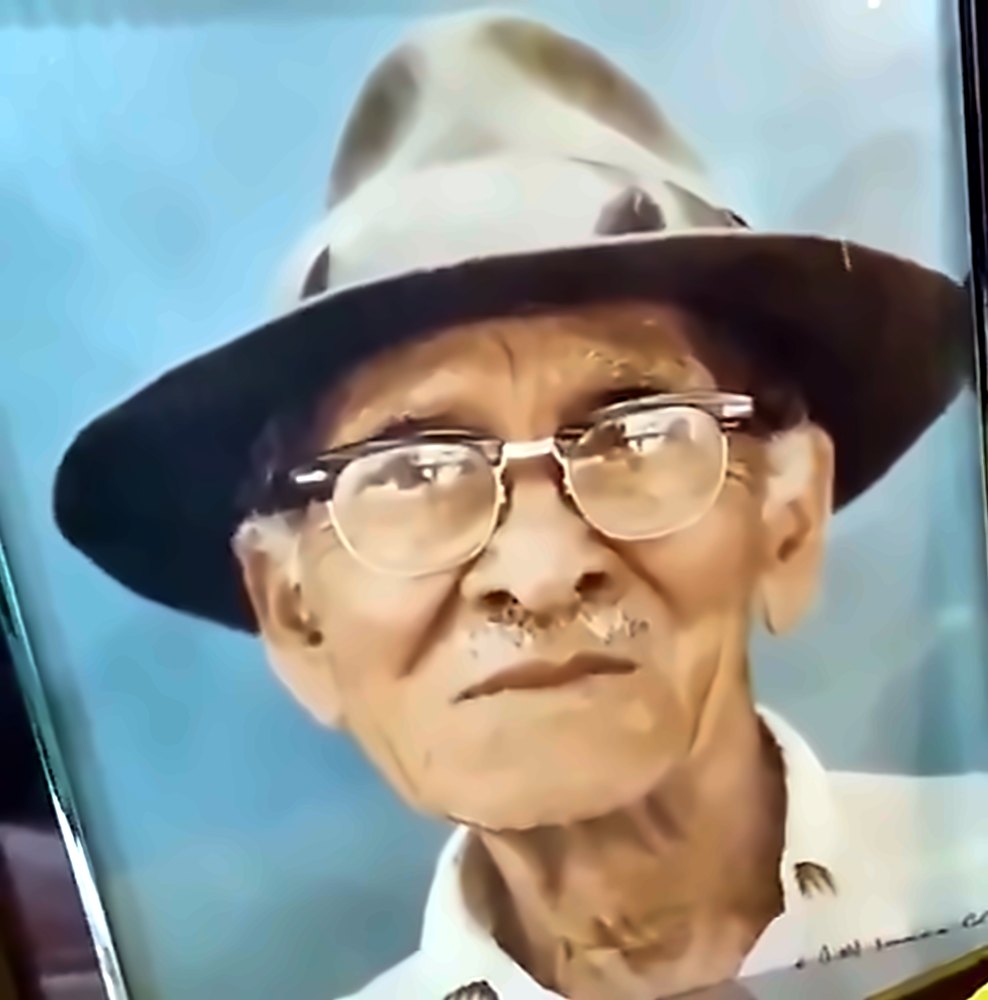 Portrait of Brooks Sherman Sr. in a hat and glasses