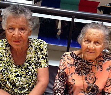 Olga and Aileen seated side by side