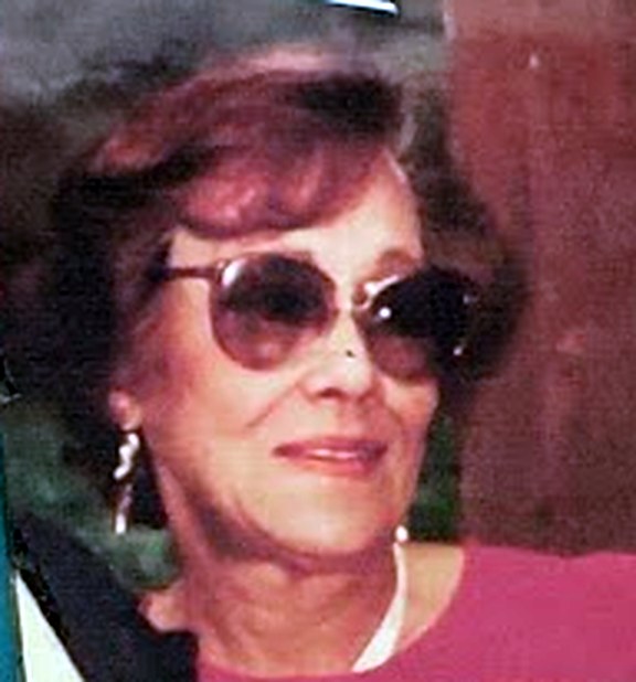 Portrait of Sybil Black, known to the family as Grammy, in sunglasses and a pink top
