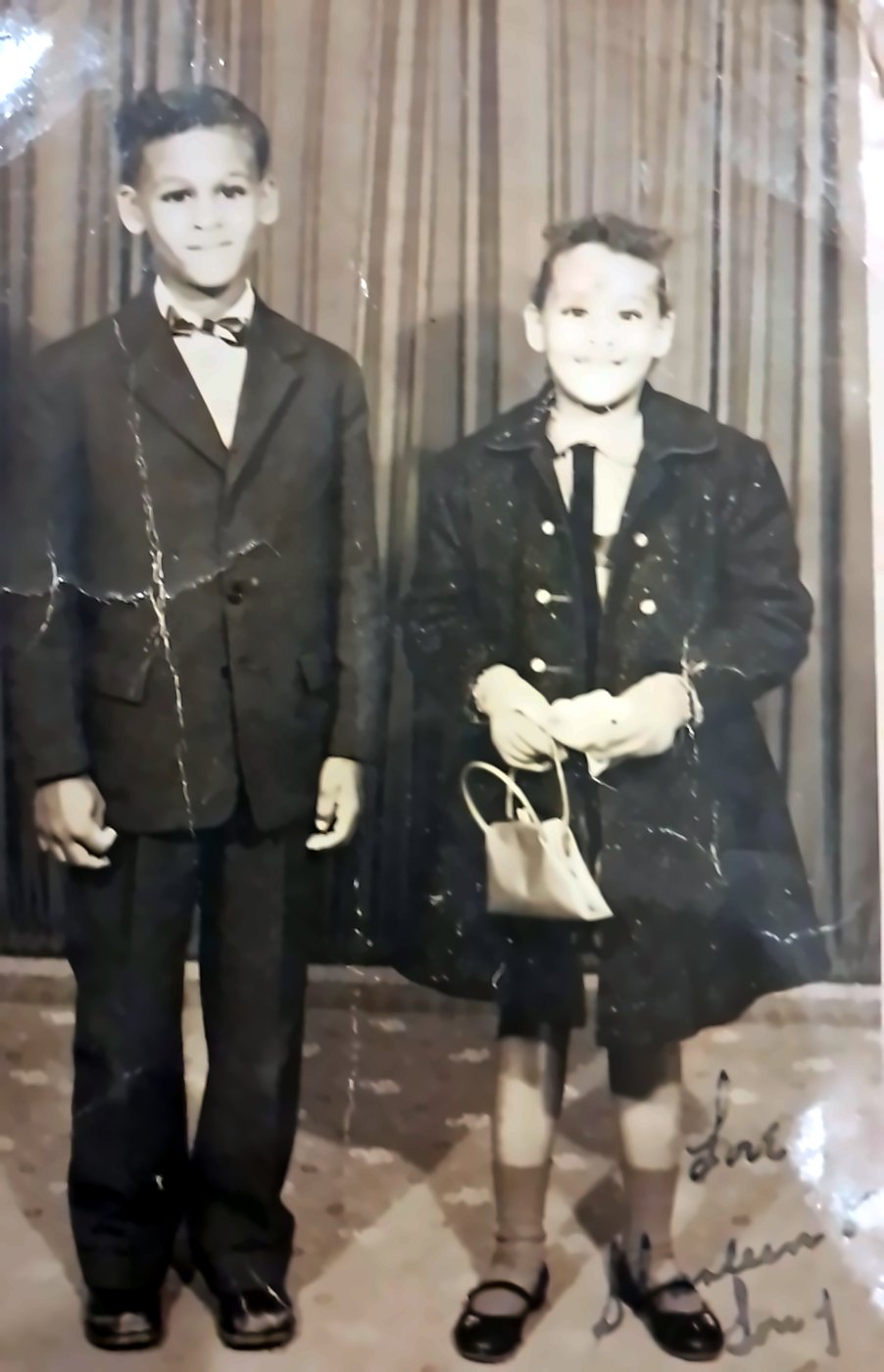 Tony and his sister Sharleen as children, dressed up for a studio portrait