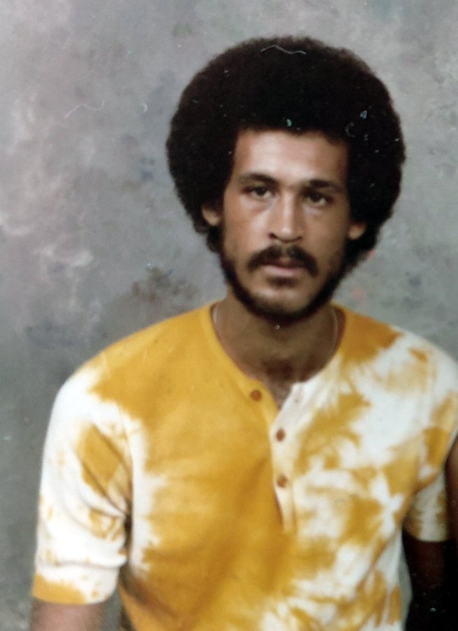 Tony as a young father in a tie-dye shirt